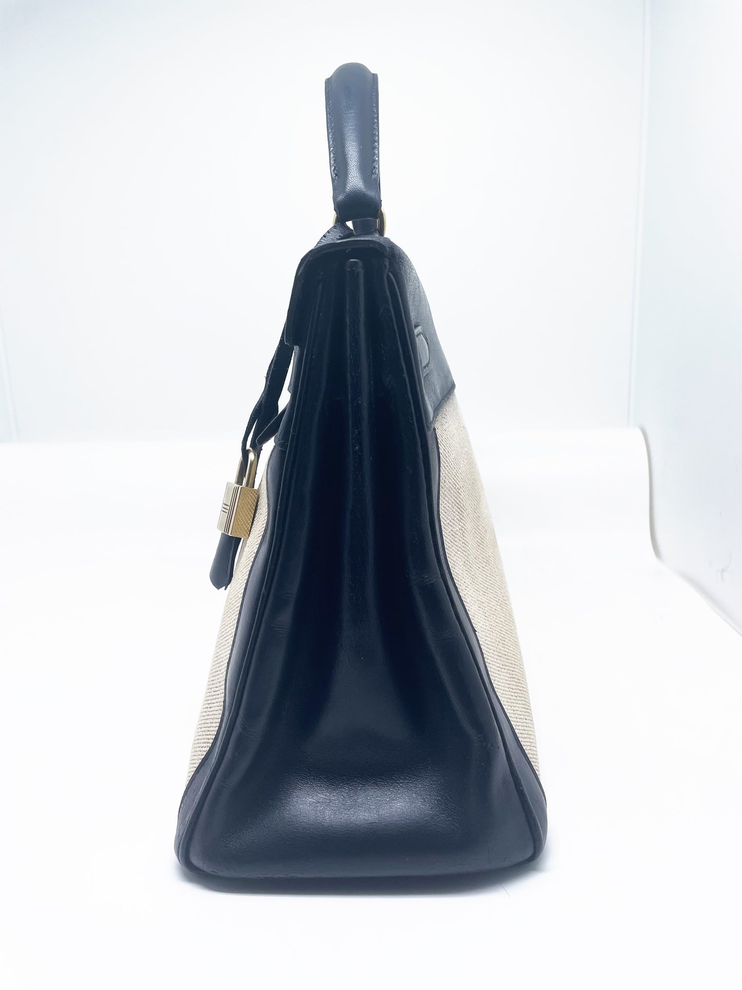 sac à main Hermès Kelly 32 retourne bi-matière en box de cuir bleu marine et toile beige - Soline
