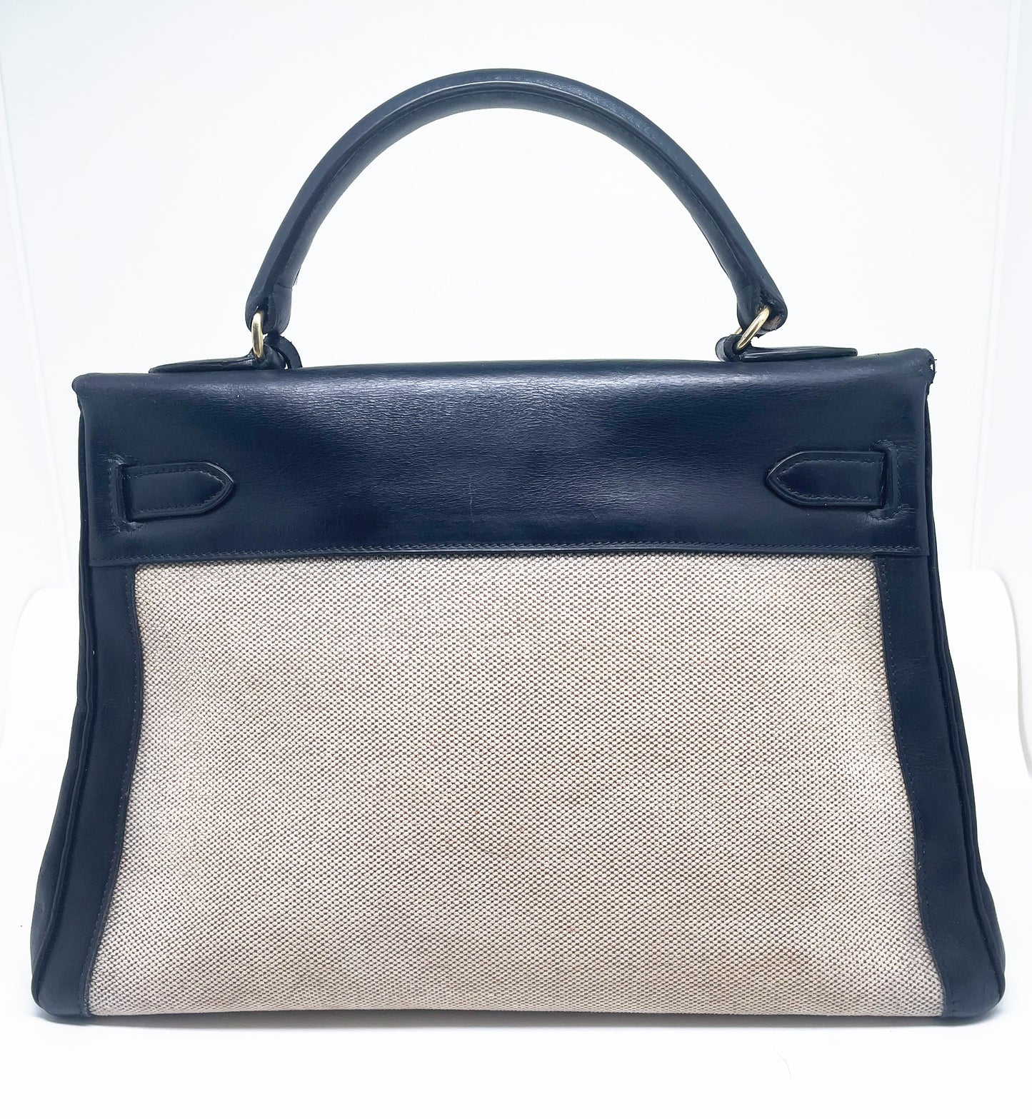 sac à main Hermès Kelly 32 retourne bi-matière en box de cuir bleu marine et toile beige - Soline