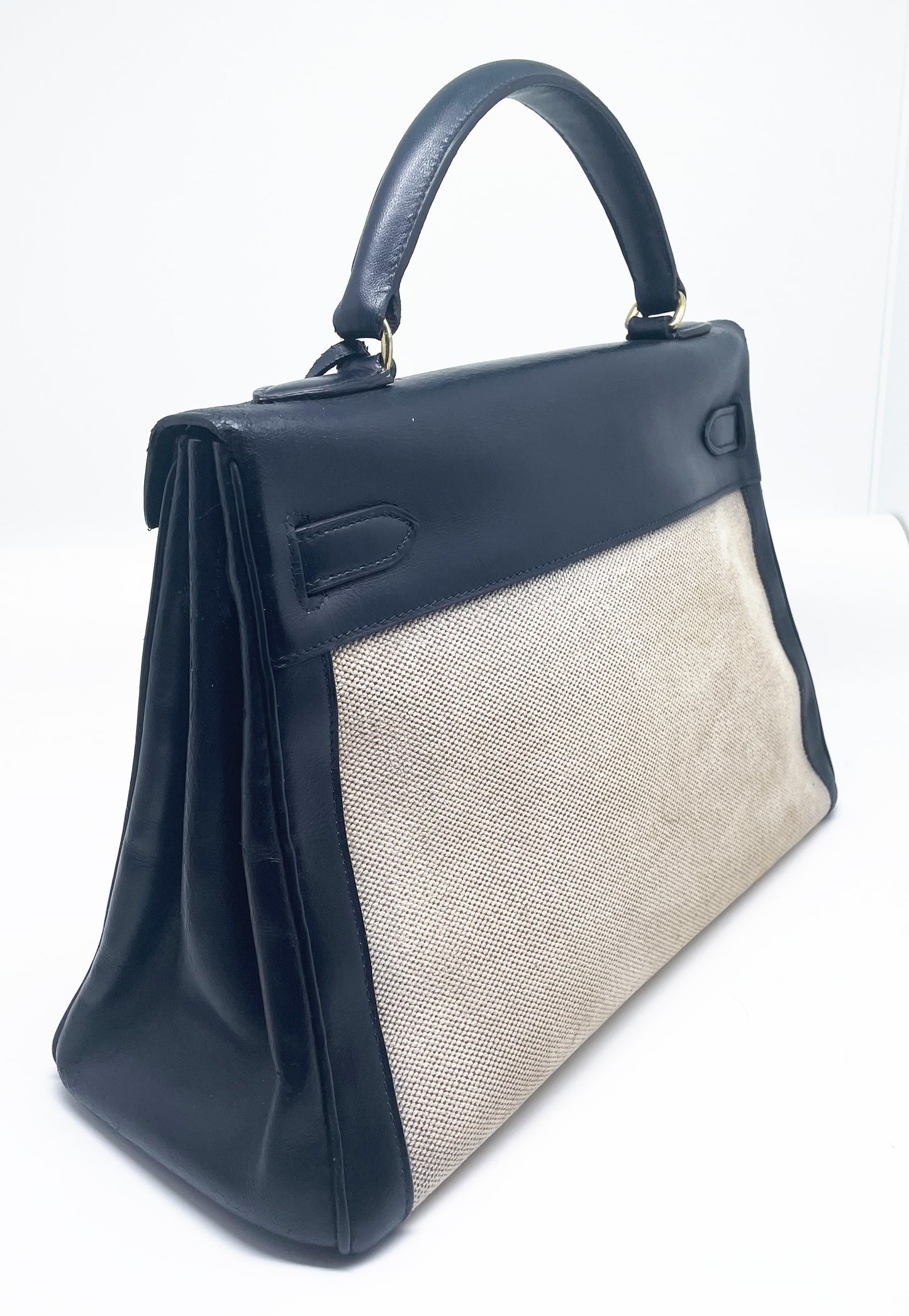 sac à main Hermès Kelly 32 retourne bi-matière en box de cuir bleu marine et toile beige - Soline
