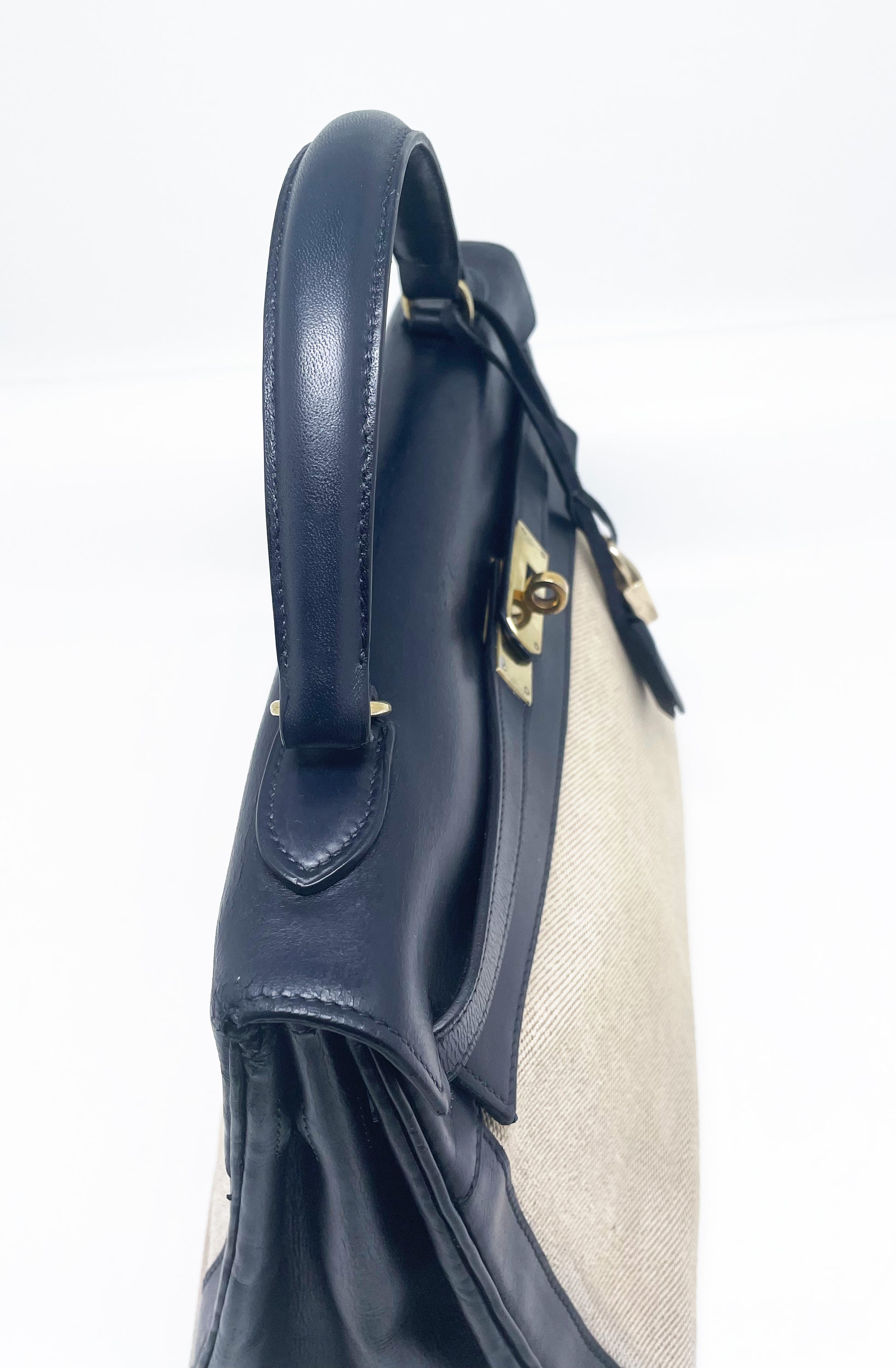sac à main Hermès Kelly 32 retourne bi-matière en box de cuir bleu marine et toile beige - Soline