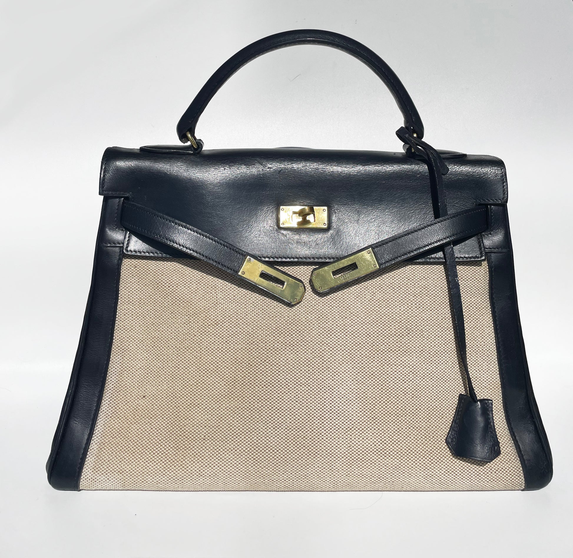 sac à main Hermès Kelly 32 retourne bi-matière en box de cuir bleu marine et toile beige - Soline