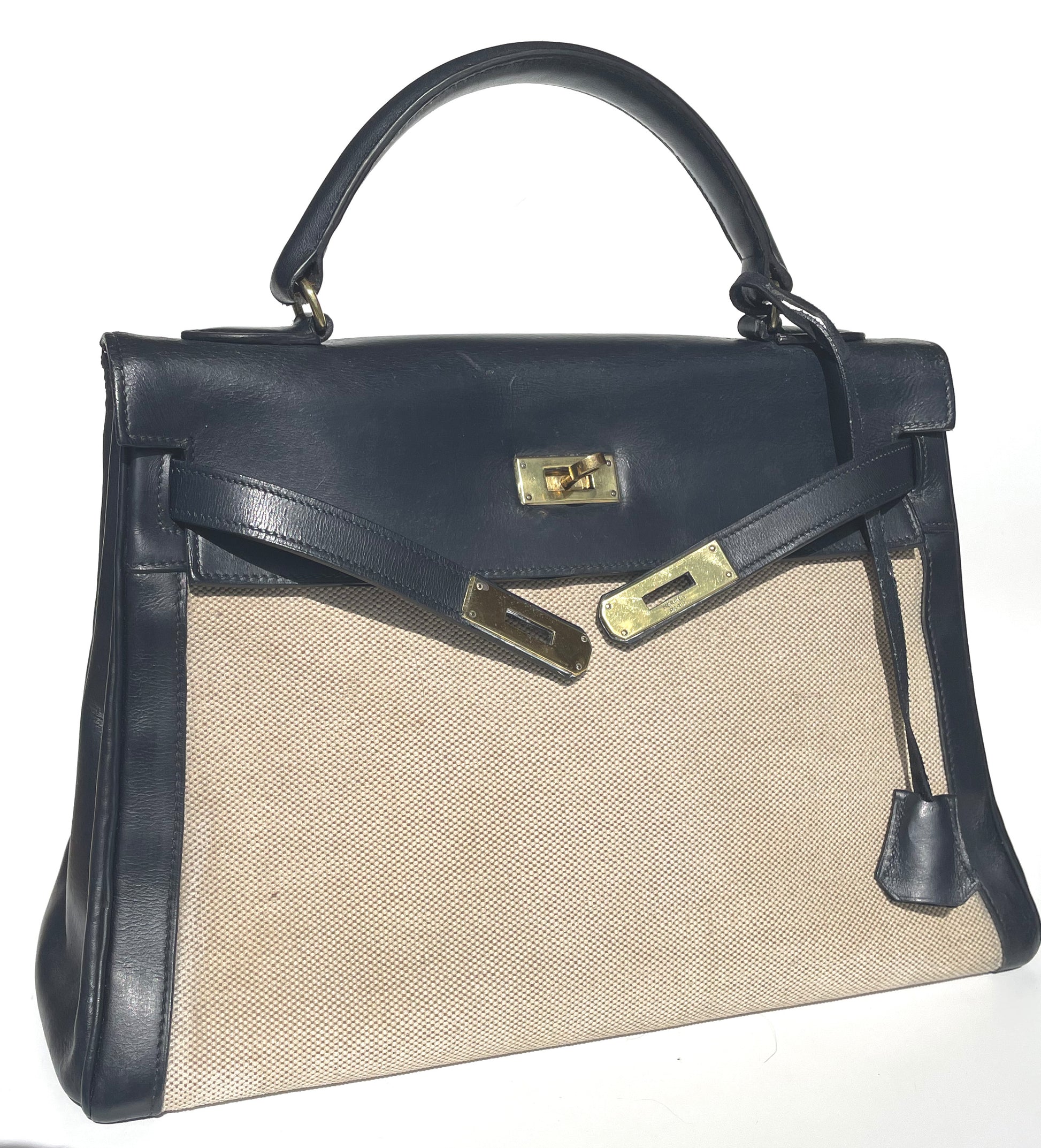 sac à main Hermès Kelly 32 retourne bi-matière en box de cuir bleu marine et toile beige - Soline
