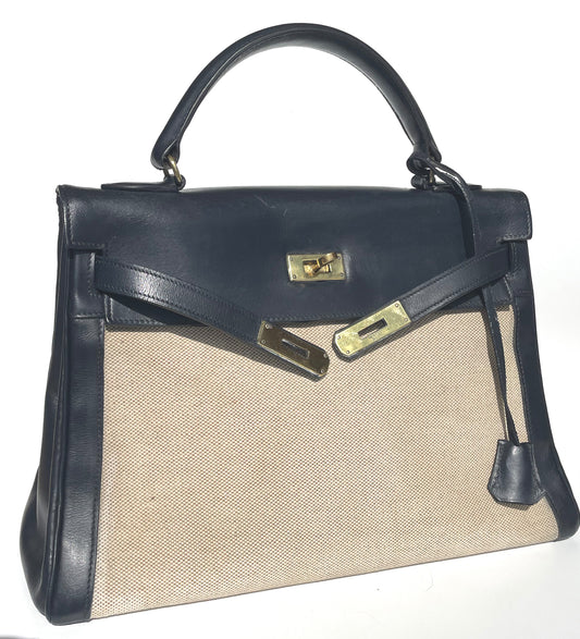 sac à main Hermès Kelly 32 retourne bi-matière en box de cuir bleu marine et toile beige - Soline