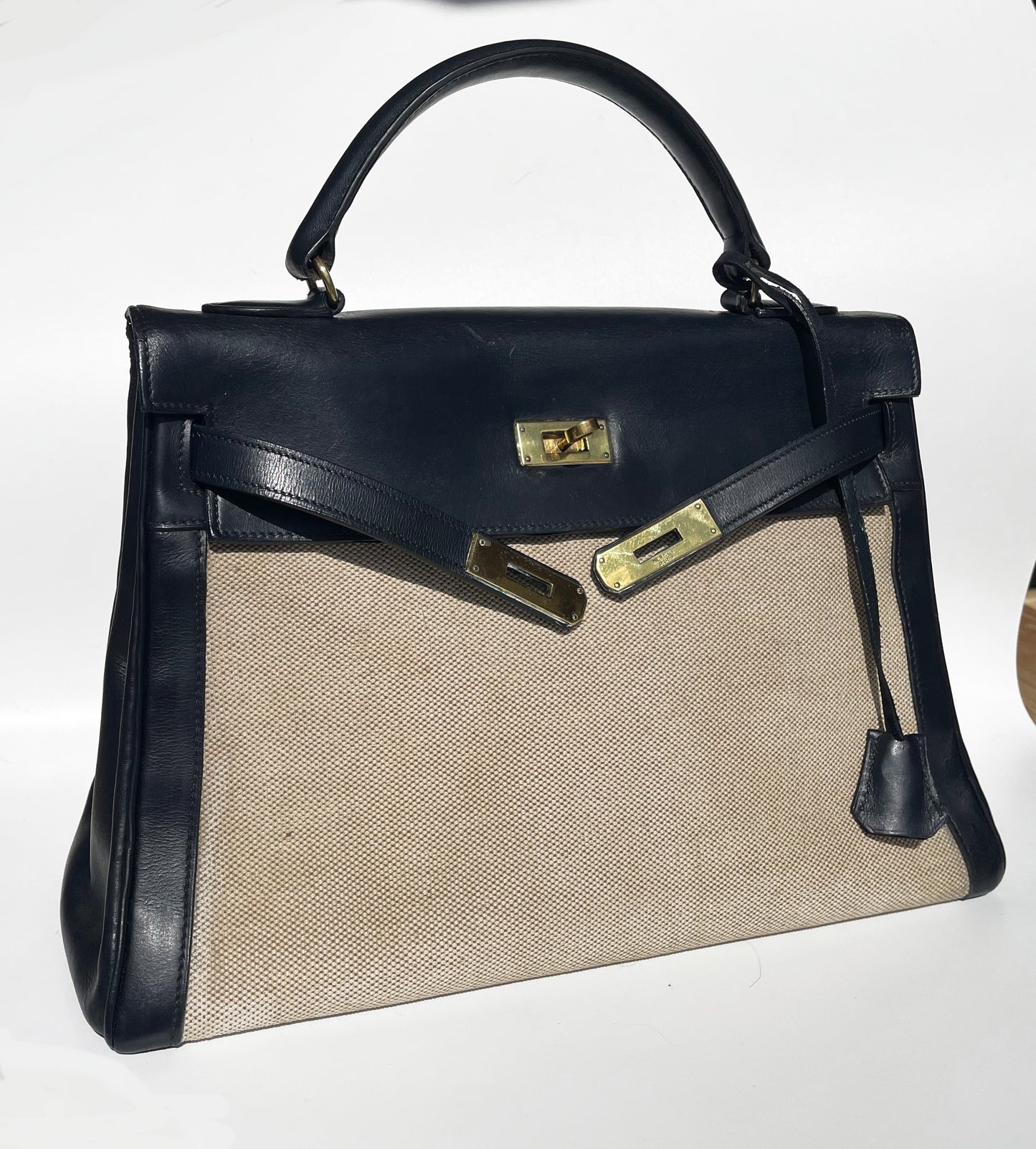 sac à main Hermès Kelly 32 retourne bi-matière en box de cuir bleu marine et toile beige - Soline