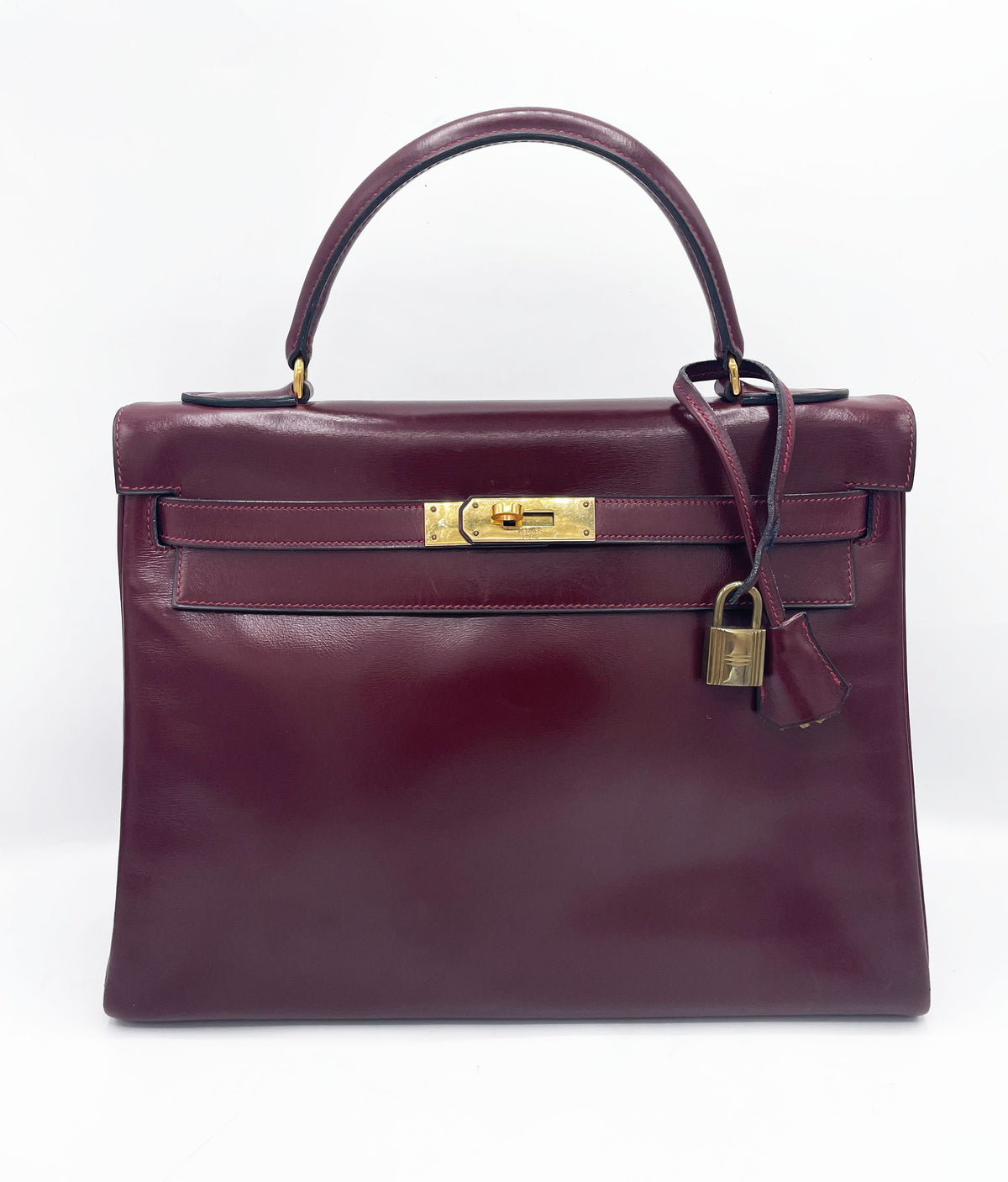 Sac Hermès Kelly 32 en cuir de box bordeaux