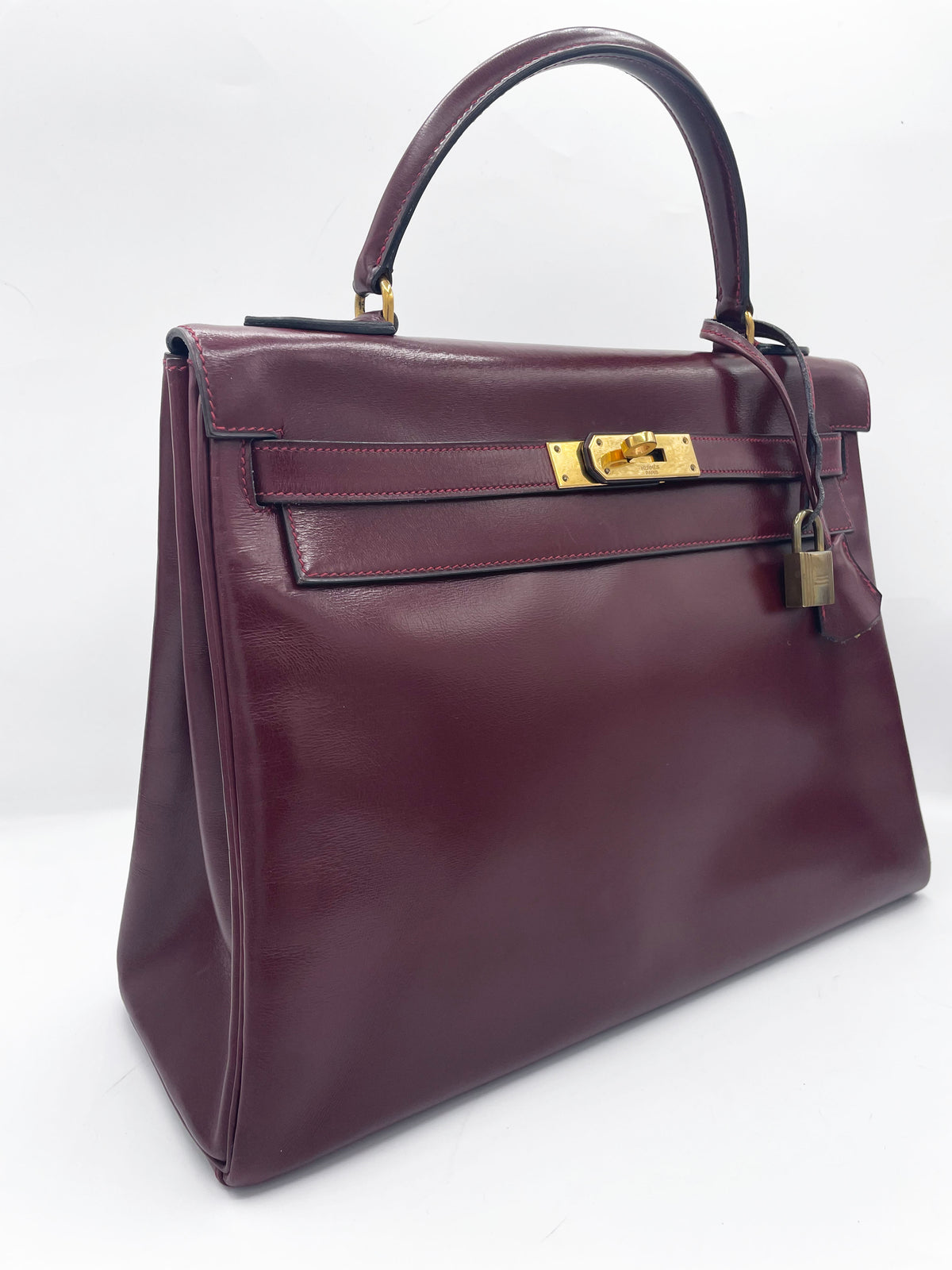 Sac Hermès Kelly 32 en cuir de box bordeaux
