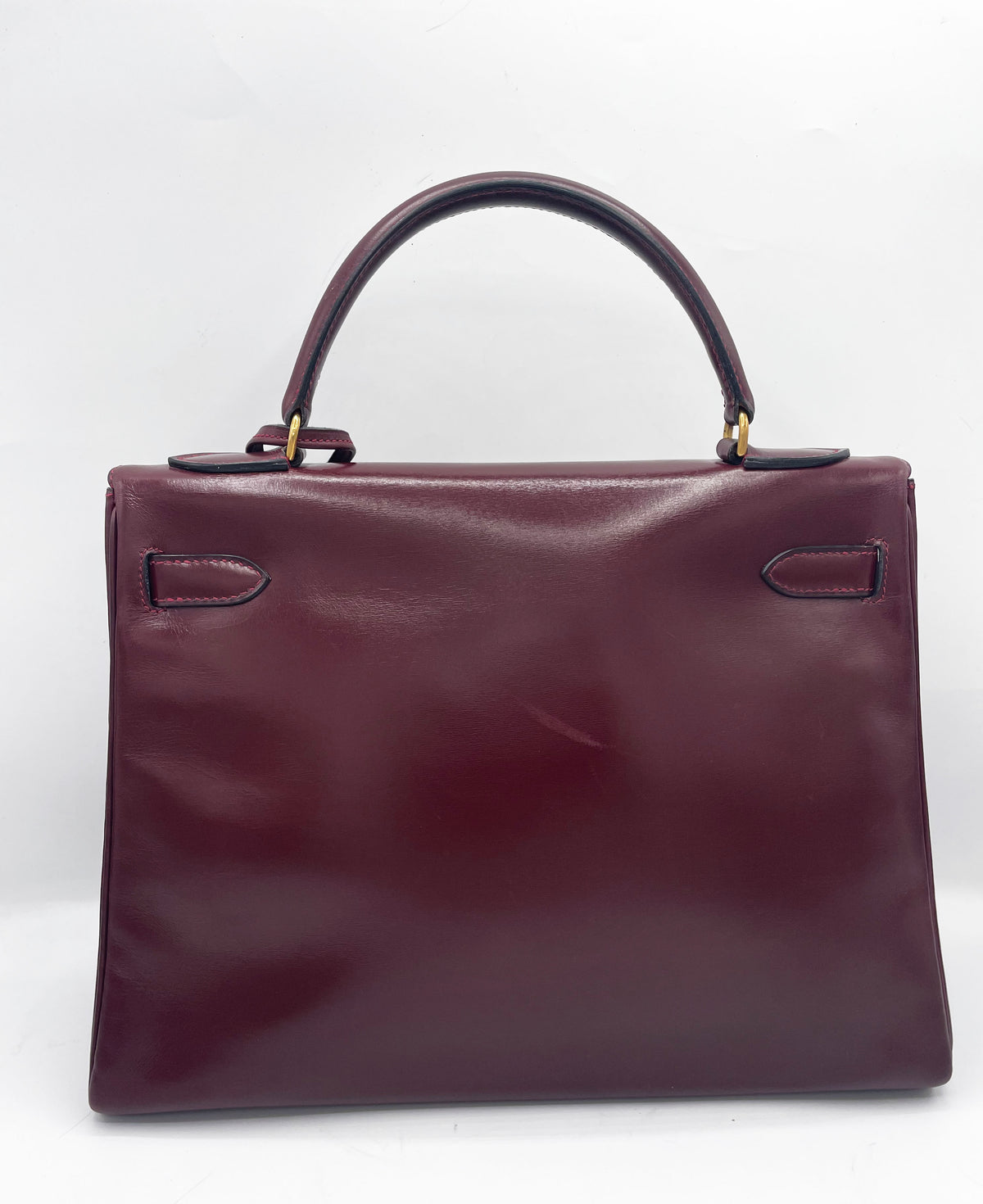 Sac Hermès Kelly 32 en cuir de box bordeaux