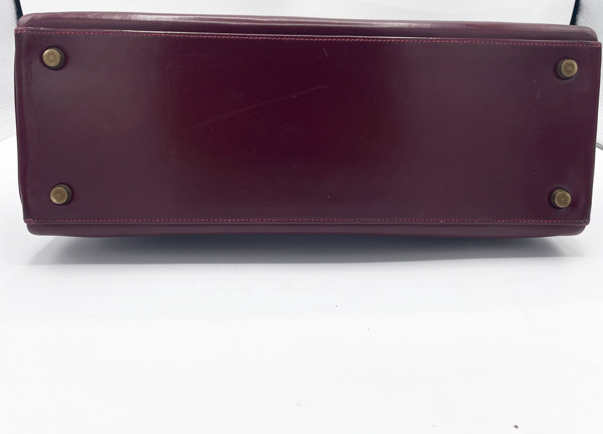 Sac Hermès Kelly 32 en cuir de box bordeaux