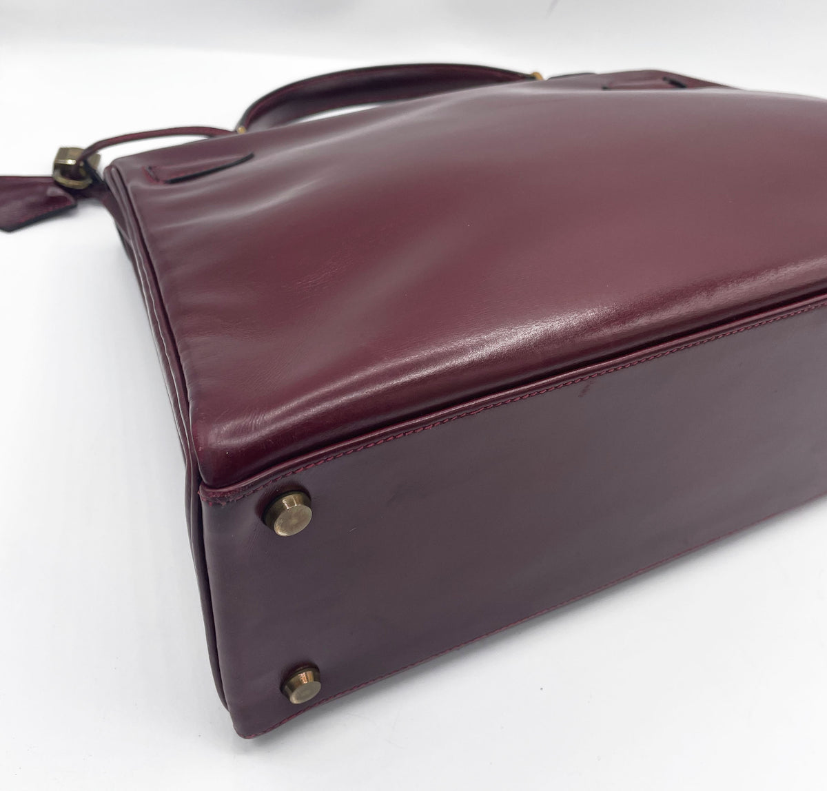 Sac Hermès Kelly 32 en cuir de box bordeaux