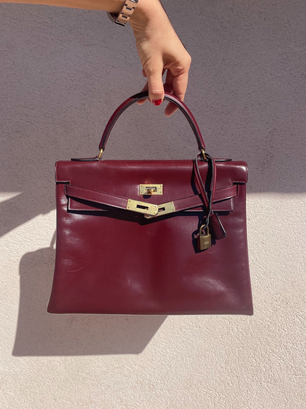 Sac Hermès Kelly 32 en cuir de box bordeaux - Soline