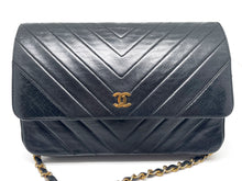 Load image into Gallery viewer, Chanel Wallet on Chain handbag in black lamb leather and chevron pattern.
