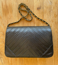 Load image into Gallery viewer, Chanel Wallet on Chain handbag in black lamb leather and chevron pattern.
