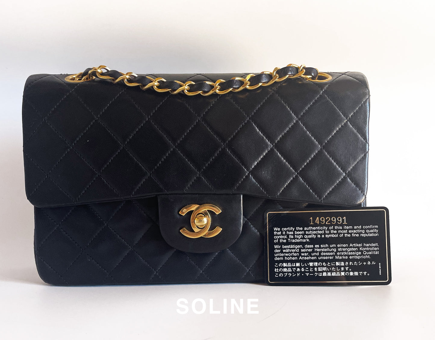 Sac à main Chanel Timeless en double rabat cuir noir 23 cm plaqué or