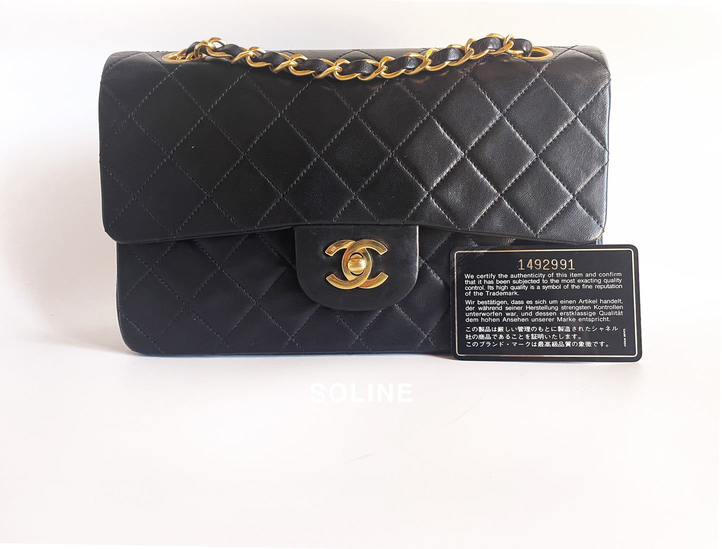 Sac à main Chanel Timeless en double rabat cuir noir 23 cm plaqué or