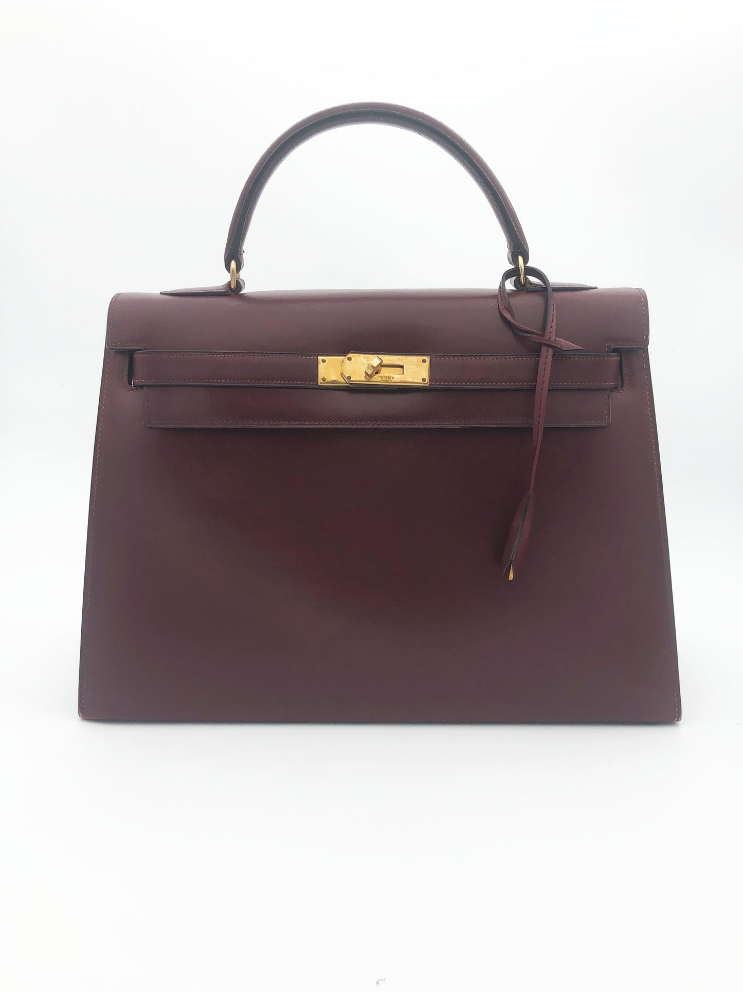 Hermès Sac Kelly 32 en cuir de box bordeaux sellier