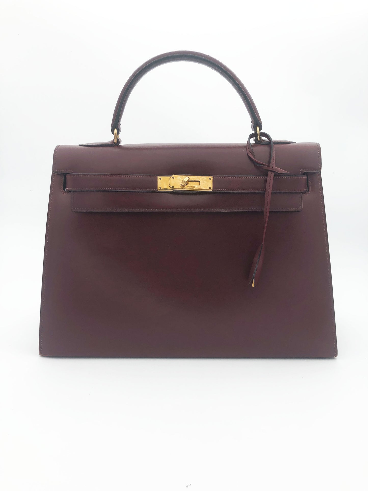 Hermès Sac Kelly 32 en cuir de box bordeaux sellier - Soline