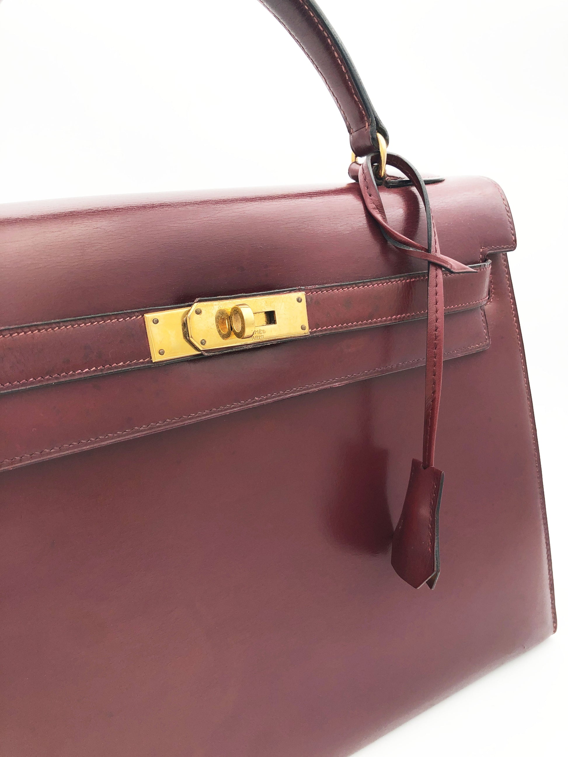 Hermès Sac Kelly 32 en cuir de box bordeaux sellier - Soline