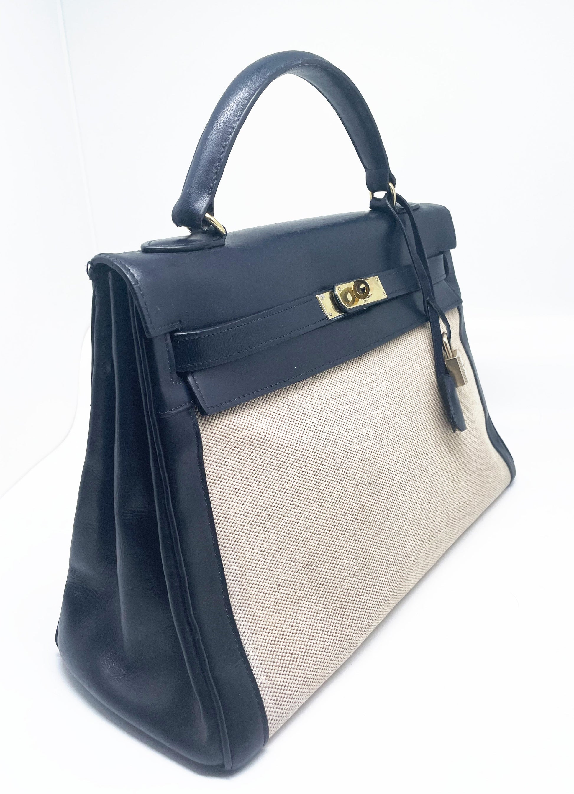 sac à main Hermès Kelly 32 retourne bi - matière en box de cuir bleu marine et toile beige - Soline