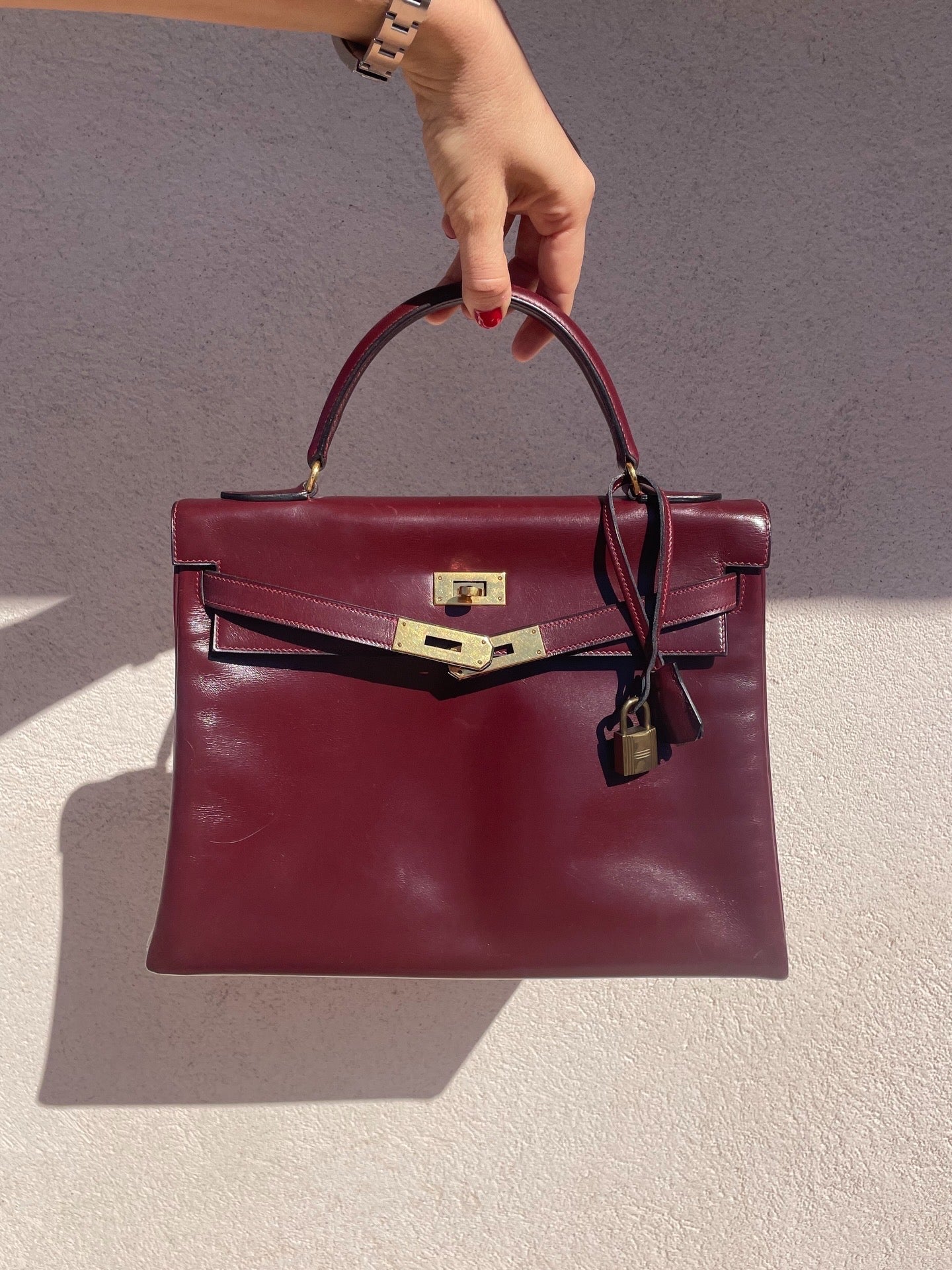 Sac Hermès Kelly 32 en cuir de box bordeaux - Soline